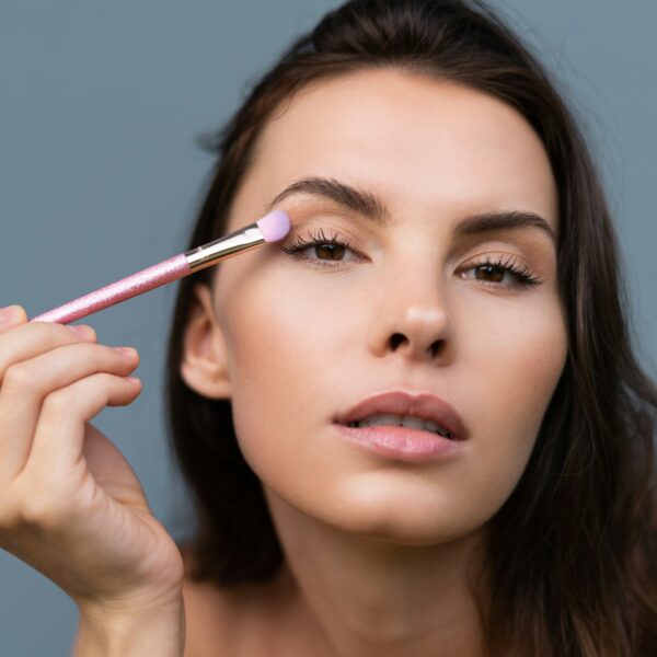 Beauty portrait of woman with perfect skin and natural makeup, full nude lips